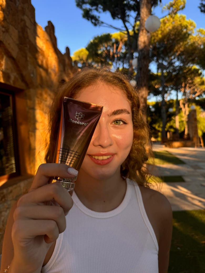 girl holding beecure